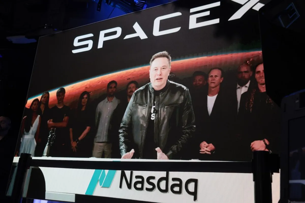 Elon Musk at the Nasdaq during SpaceX's IPO, days before the Cursor acquisition was confirmed